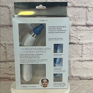 Microdermabrasion Device with four interchangeable suction heads